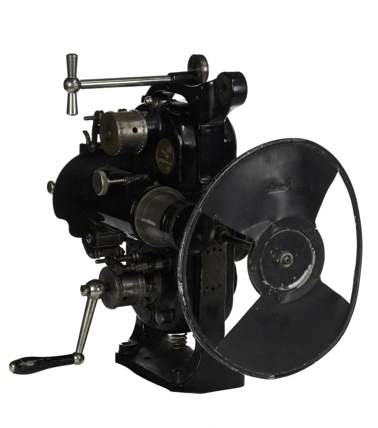 Vintage projector from the 1906 with a hand crank and lens assembly