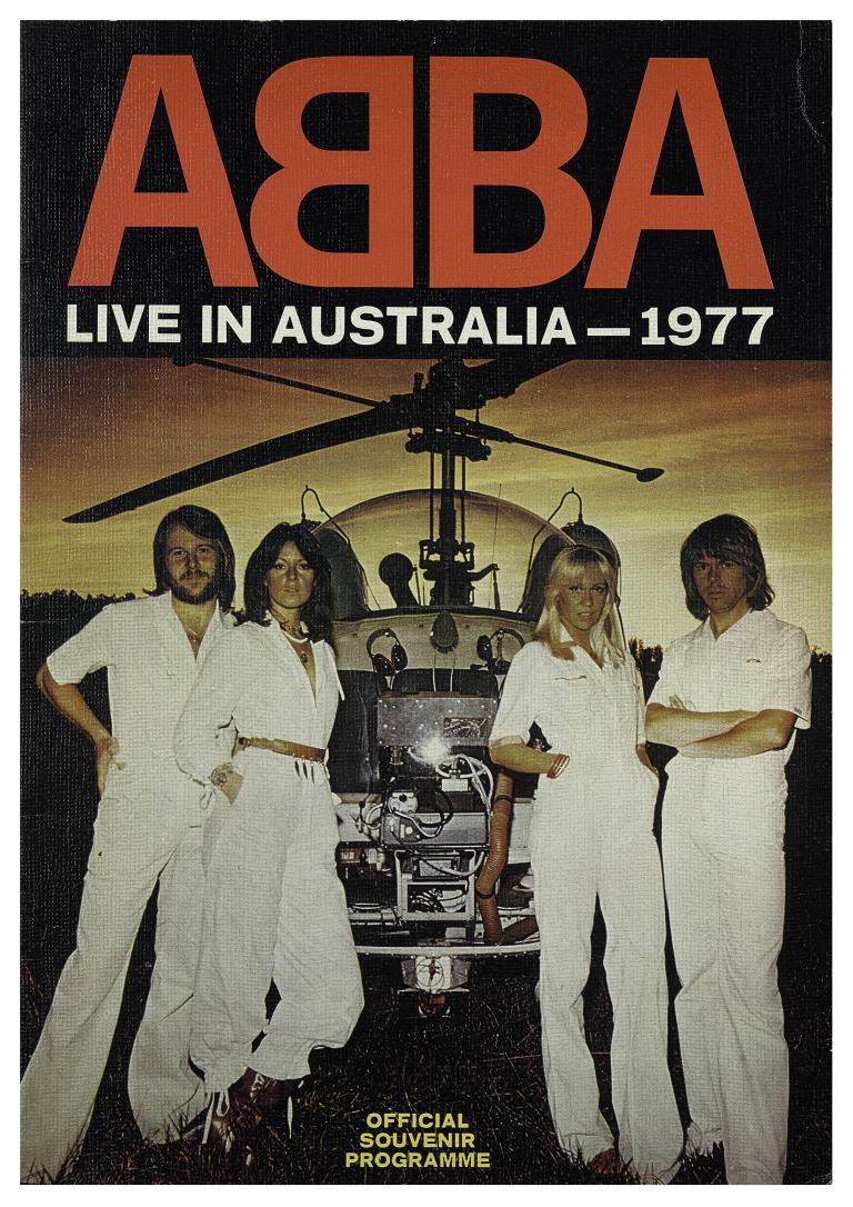 Cover of ABBA: Live in Australia 1977 tour program, showing the band on stage under spotlights with helicopter in background