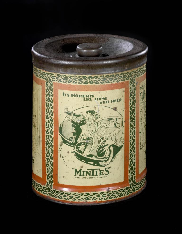 Vintage Minties tin with cartoon illustration and slogan 'the universal sweet' on a black background