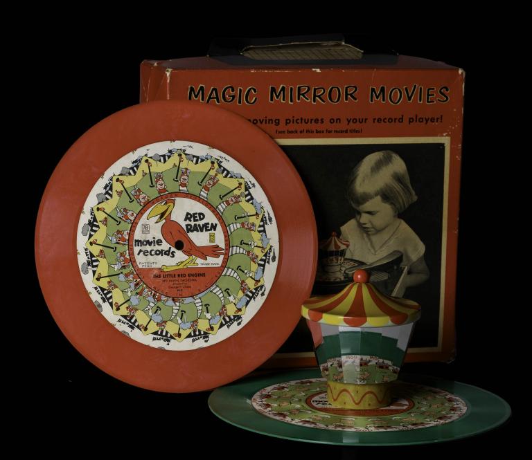 Red Raven record with a carousel topper, and Magic Mirror Movies box showing a child using the device from the 1950s