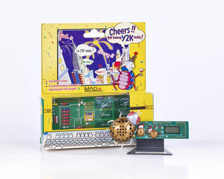 Y2K promotional kit with countdown clock and novelty toy displayed in colorful packaging from 1999