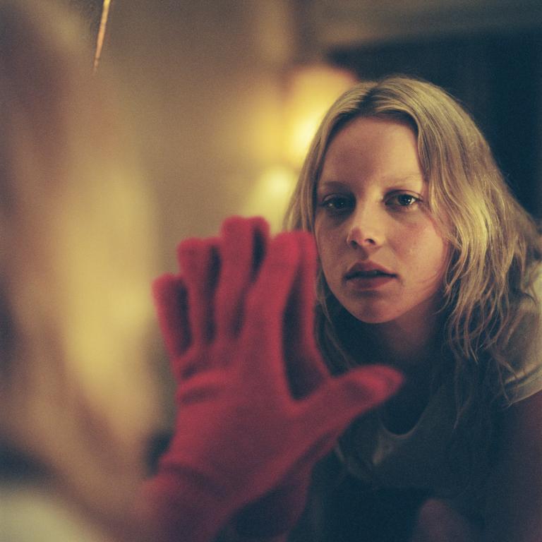 Abbie Cornish puts her hand up against a mirror in a scene from the film Somersault