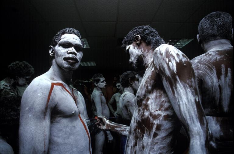 A group of Aboriginal men with their bodies painted for a ceremony.
