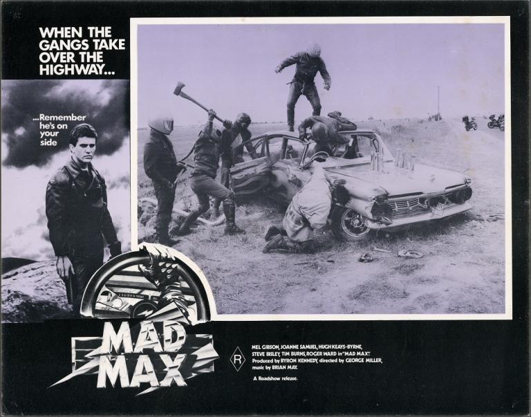 Lobby card for Max Max shows a gang attacking a car.