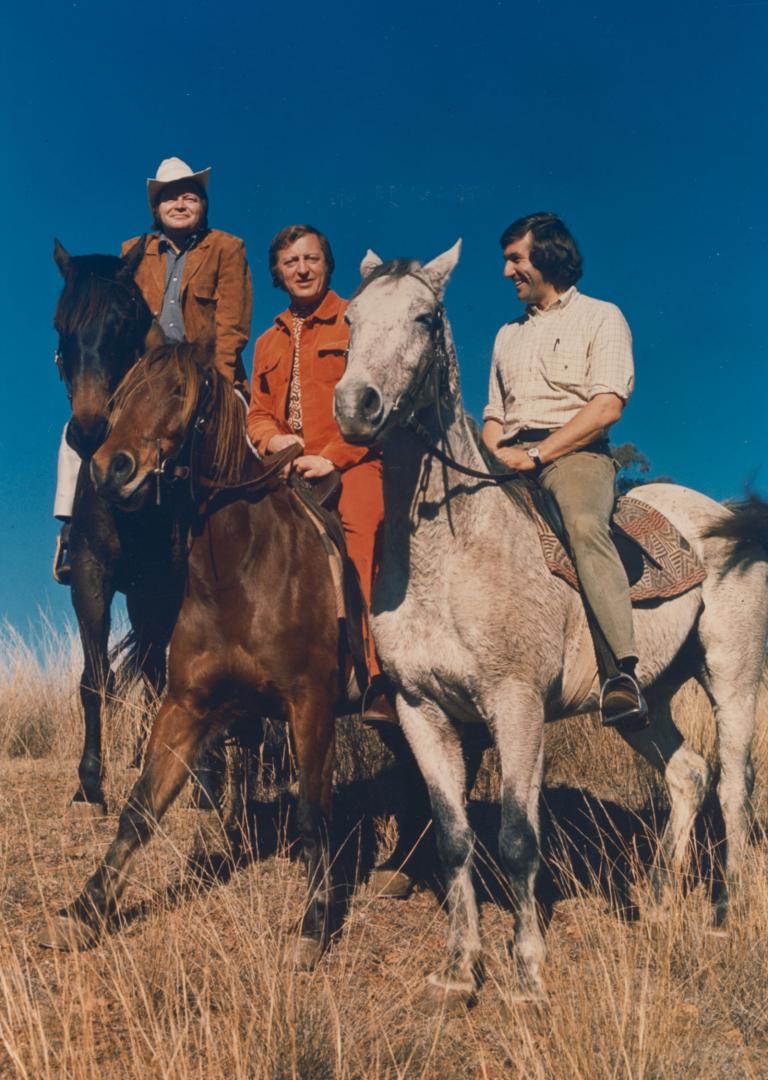 Bert Newton, Graham Kennedy and Harry M Miller riding horses. 