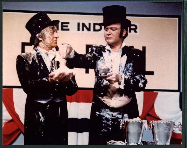 Graham and Bert both wearing top hat and tails and covered in cream pie during a skit for The Graham Kennedy Show.