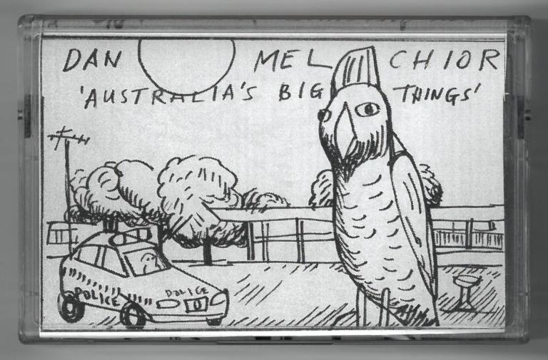 Cassette cover featuring a crude drawing of a cockatoo and a police car in the suburbs. Text reads: Dan Melchior. Australia's Big Things.
