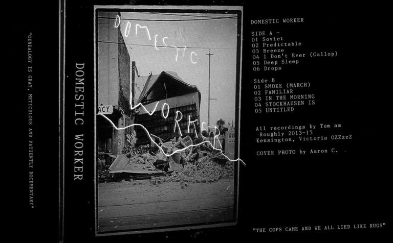 Cassette cover featuring a partly destroyed building. Text reads: Domestic Worker.