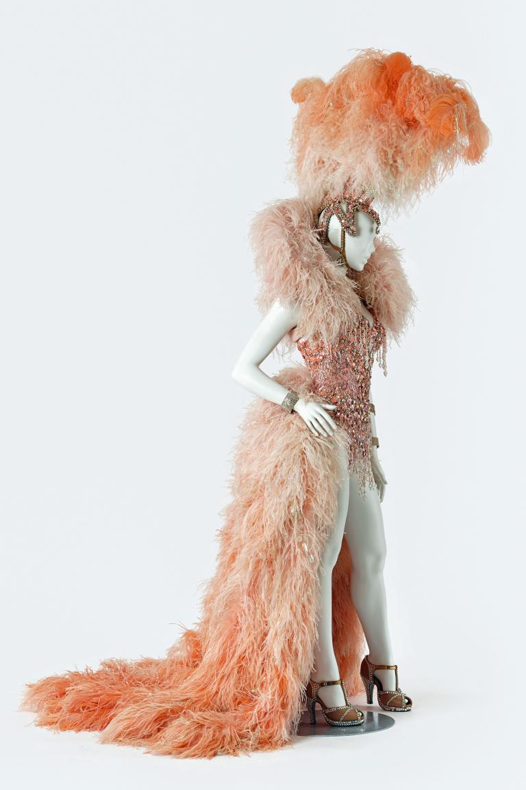Feather and beaded Showgirl costume and headdress worn by Kylie Minogue in a concert tour.