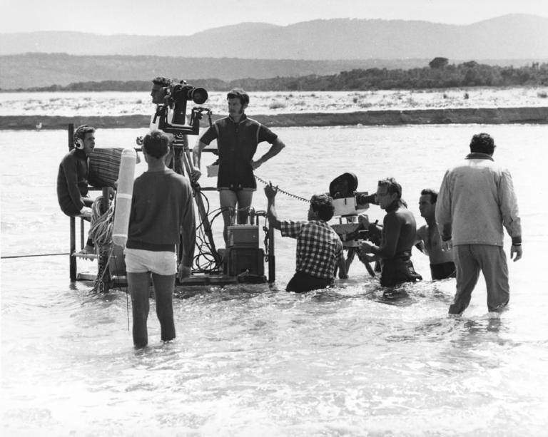 Skippy camera crew setting up a shot in shallow water.