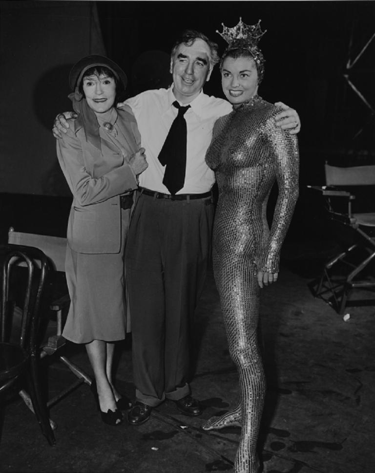Annette Kellerman on the set of Million Dollar Mermaid with Esther William wearing a gold sequined unitard. 