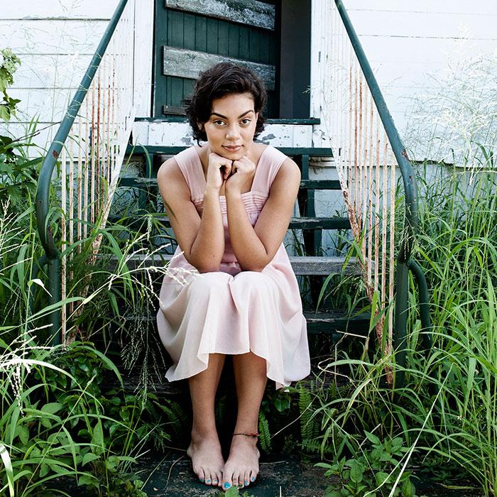 Thelma Plum Thelma Plumb sitting on back stairs resting her elbows on knees and chin on hands