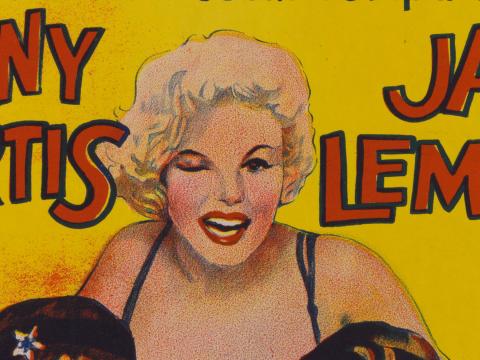 Part of a film poster showing a drawing of a blond woman winking.