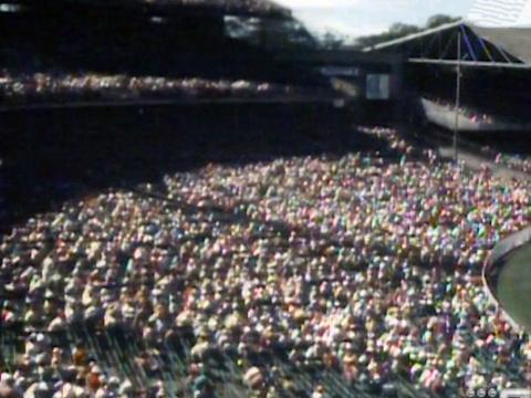 A stand at a cricket stadium full of spectators