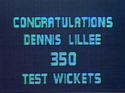 A sign that reads 'Congratulations Dennis Lillee 350 test wickets'