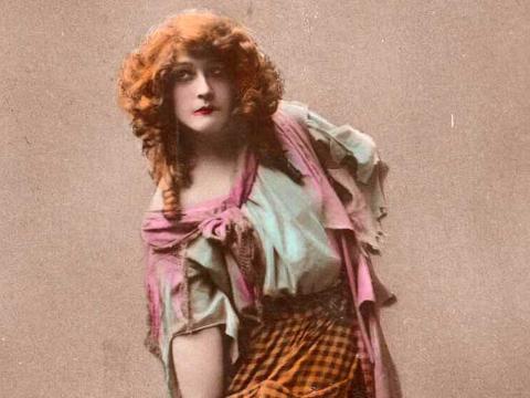 Colourised image of actor Nellie Steward, c1930s, pictured from waist up and leaning slightly forward.
