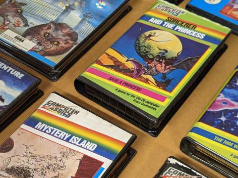 Video game covers laid out on a table.