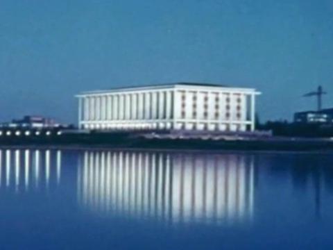 The National Library of Australia in Canberra seen across Lake Burley Griffin at night in the 1960s.