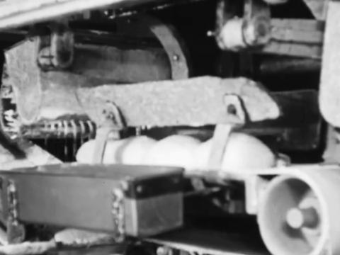 Dough is going through a machine to be baked into bread