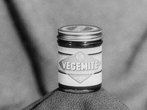 A jar of Vegemite in black and white