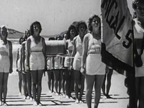 Female lifesavers from Terrigal Surf Life Saving Club participate in a march past