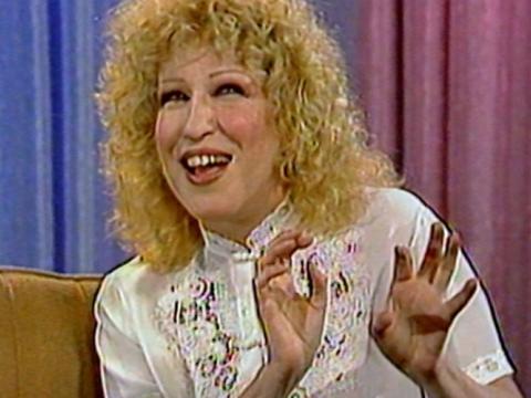 Bette Midler is talking. She is gesticulating with her hands.
