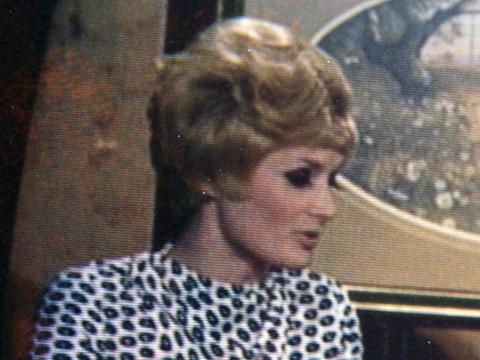Head and shoulders shot of a young woman looking sideways