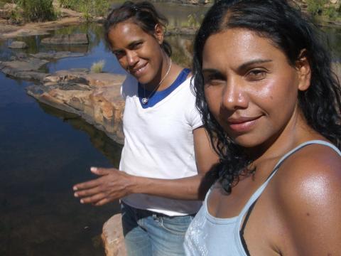 Cathy Freeman and Deborah Mailman pictured near a lake, both are looking towards camera.