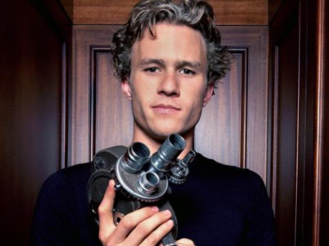 Heath Ledger holding a Bell and Howell 70D 16mm motion picture camera.
