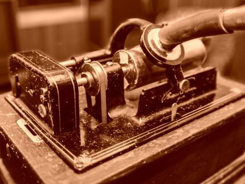 Close up of the body of Edison Standard B model phonograph in sepia tone