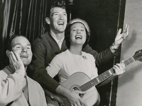 Binny Lum pictured with Col Joy, playing guitar, 1962