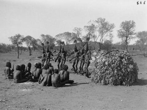 Black and white image of Arrernte men performing dances from the Tjitjingalla corroboree in Alice Springs.