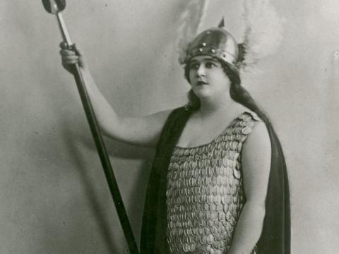 Florence Austral in costume as Brunhilde with spear, shield and winged helmet.
