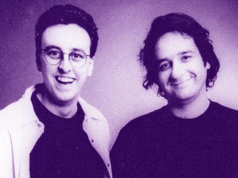 Tony Martin and Mick Molloy pictured from the chest up, smiling directly at camera