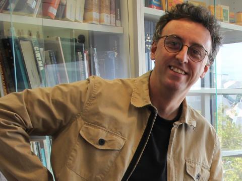 Writer and comedian Tony Martin smiling at camera