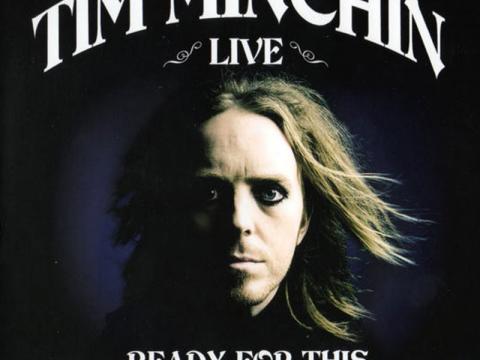 An album cover showing a picture of Tim Minchin with a dark background. The text says 'Tim Minchin live: Ready for This'.