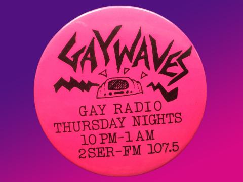 A round hot pink badge that says 'Gaywaves' on it.