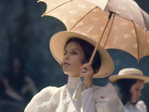 Helen Morse as the French mistress carries a parasol in a scene from Picnic at Hanging Rock