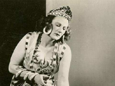 Marjorie Lawrenceknleeling and dressed as Salome.