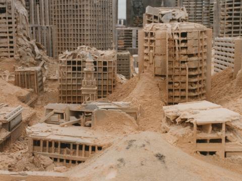Close up of a model set of buildings created for the set of post-apocalyptic Sydney in Mad Max Beyond Thunderdome. The clock tower of the General Post Office in Martin Place is recognisable amongst the rubble.