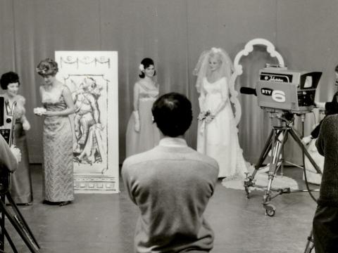 People in a TV studio filming a show about fashion. 