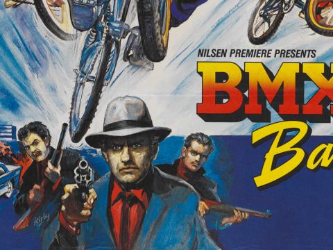 Poster art showing part of a BMX Bandits poster with some mobsters pointing firearms. Above their heads are bicycle wheels and part of the film title in block letters.