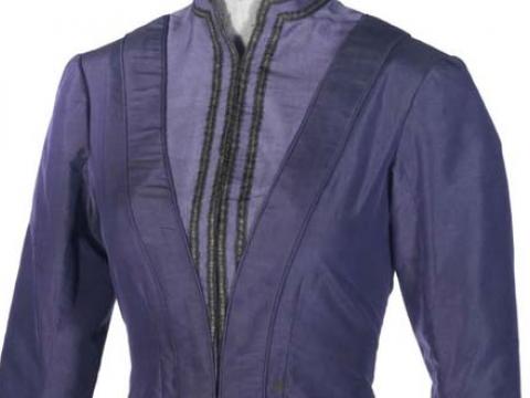 Close up of a bodice of a lavender coloured, Victorian style dress.
