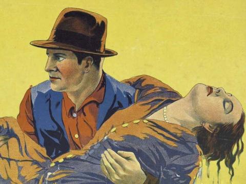 Detail from a 1929 film poster showing a man carrying a woman