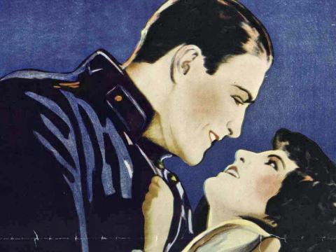 A woman swoons in a man's arms in a close-up from a 1929 film poster
