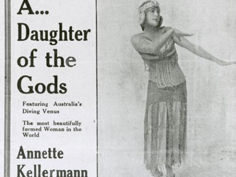 A photograph of Annette Kellerman wearing an Arabian-inspired costume. The text next to her says: 'A Daughter of the Gods ... featuring Annette Kellerman'.