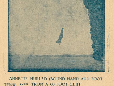 A person diving from a cliff into the sea. Underneath is the text: 'Annette hurled (bound hand and foot) from a 60 foot cliff.