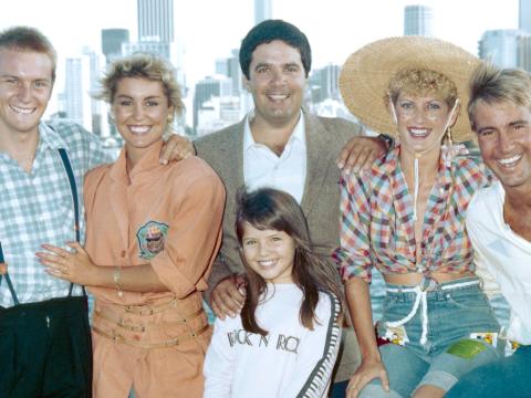 The Wonder World Team, circa 1985. Pictured left to right: Phillip Tanner, Malinda Rutter, Simon Townsend, Edith Bliss, Brett Clements, and in front is Dear Danni and Woodrow the Bloodhound.