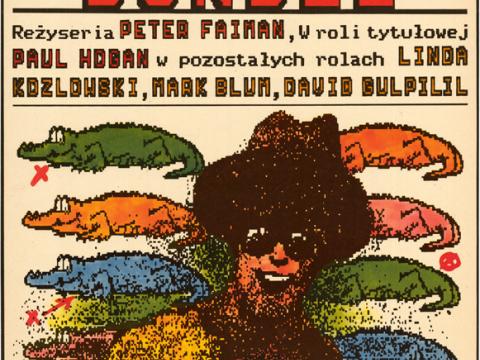 Polish poster for Crocodile Dundee featuring eight multi-coloured crocodiles, a smiling man in a hat and sunglasses and someone screaming underneath him