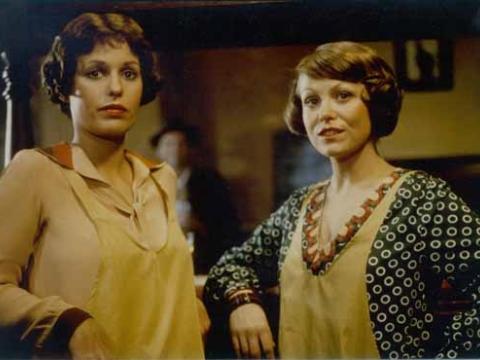 Film still of Helen Morse as Caddie and Jacki Weaver as Josie in a pub looking  at the camera.